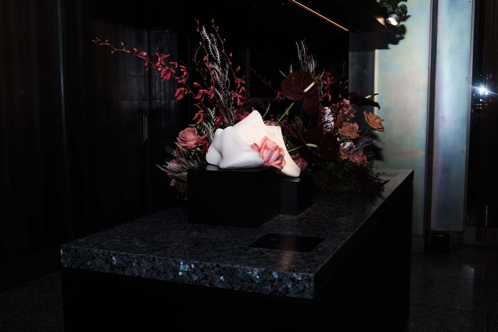 A floral installation lit from below