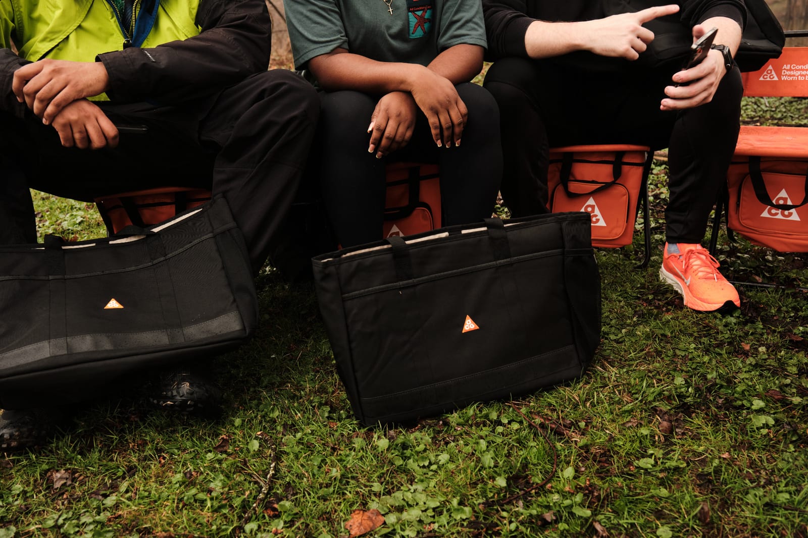 Crew sitting with their bags between runs