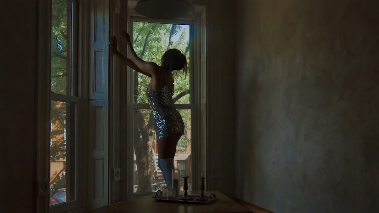 A dancer leaving through a window, from the short film Alone