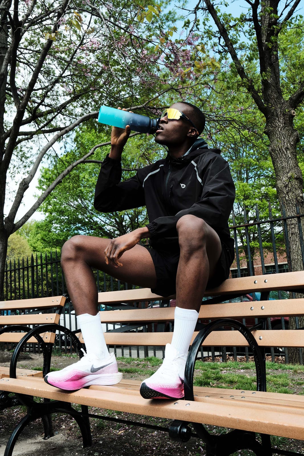 Sitting on a park bench mid drink