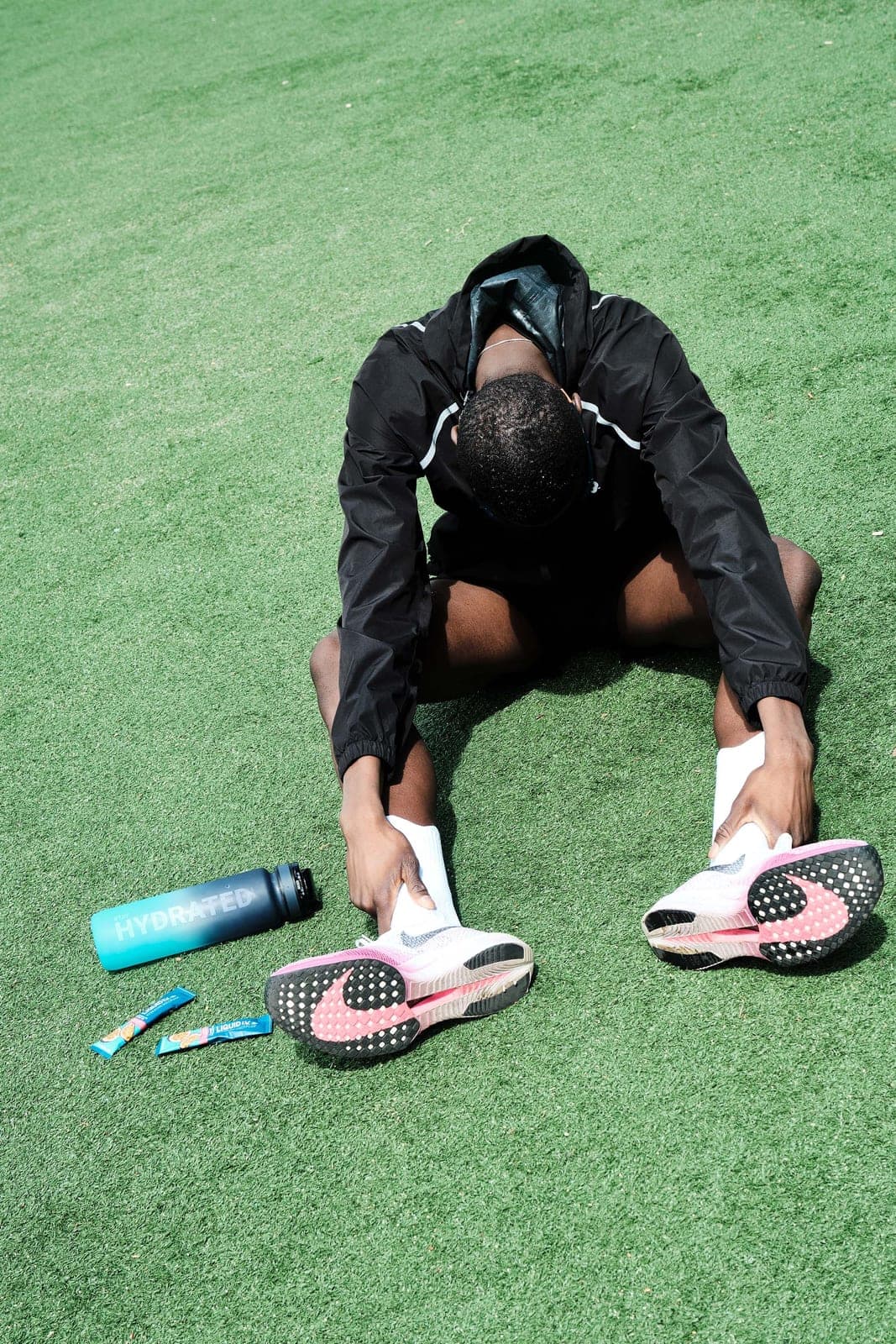 Folded over on the turf, catching breath