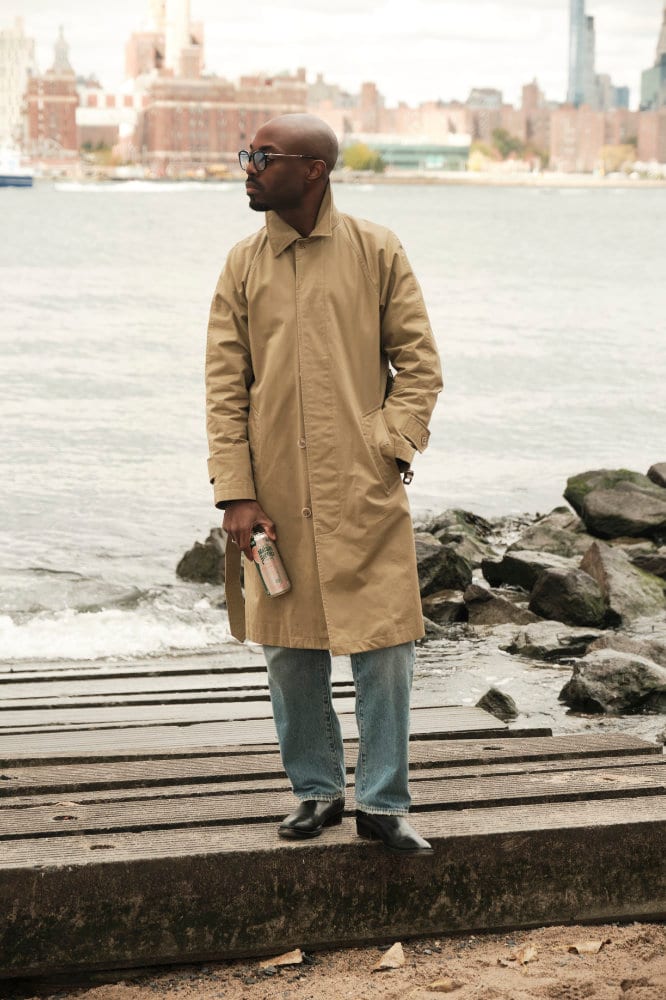 Standing on the pier in a long camel coat